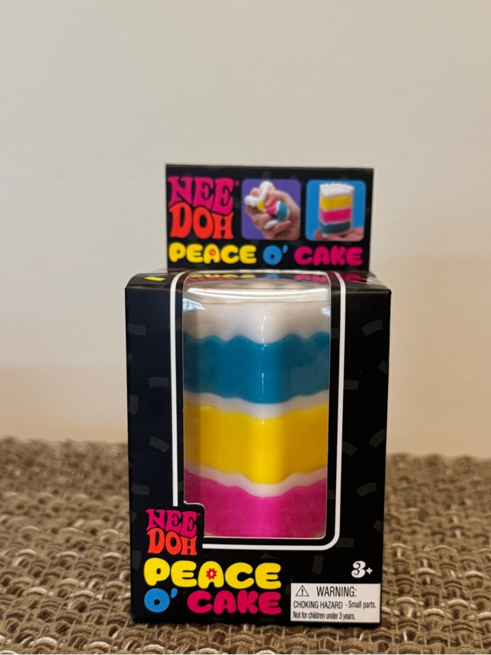 NeeDoh Peace O' Cake Layered Squishy Toy - White, Blue, Yellow, Pink